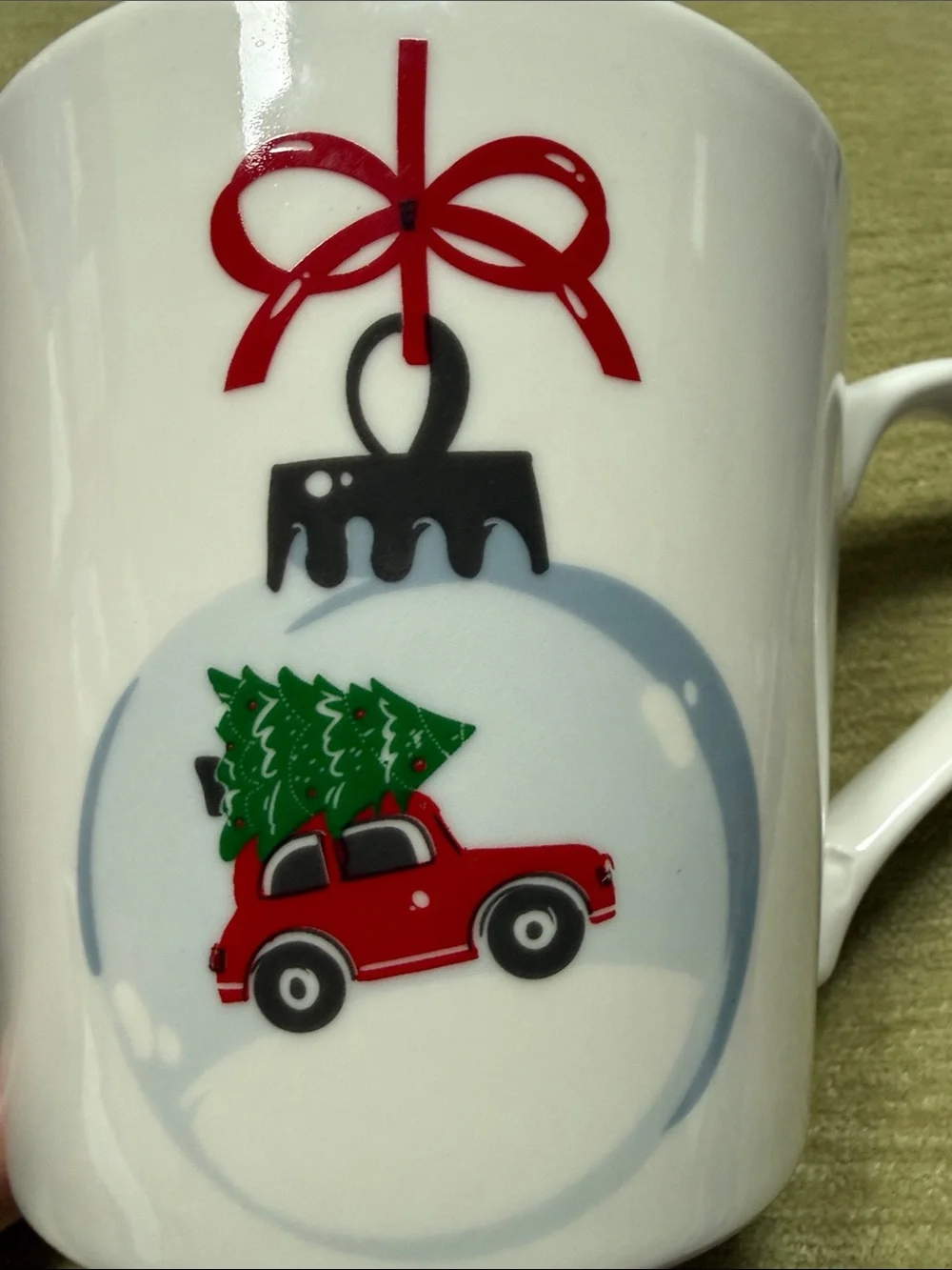 Maude Borup Mug Decorated w/ a Christmas Tree Atop a Red Car in a Round Ornament